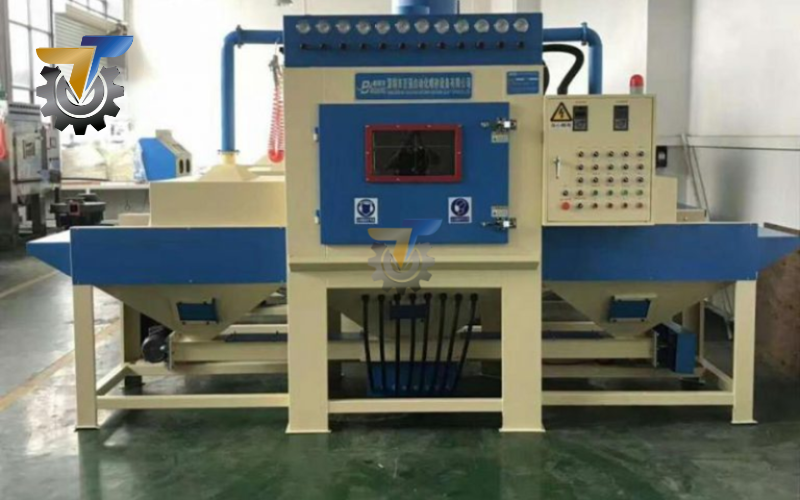 Máy phun cát dạng băng tải