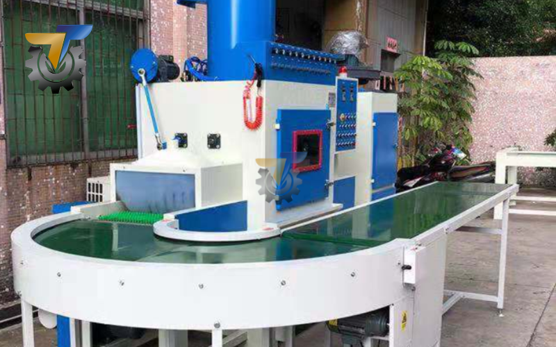 Máy phun cát dạng băng tải 