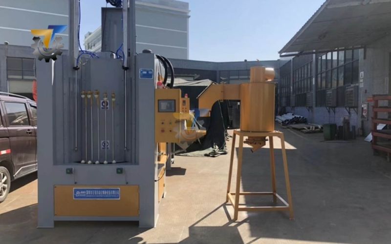 nguyên lý hoạt động của máy phun cát mâm xoay tự động